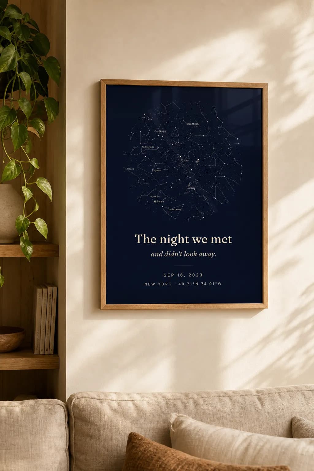A framed SkyWhen star map print on a living-room wall
