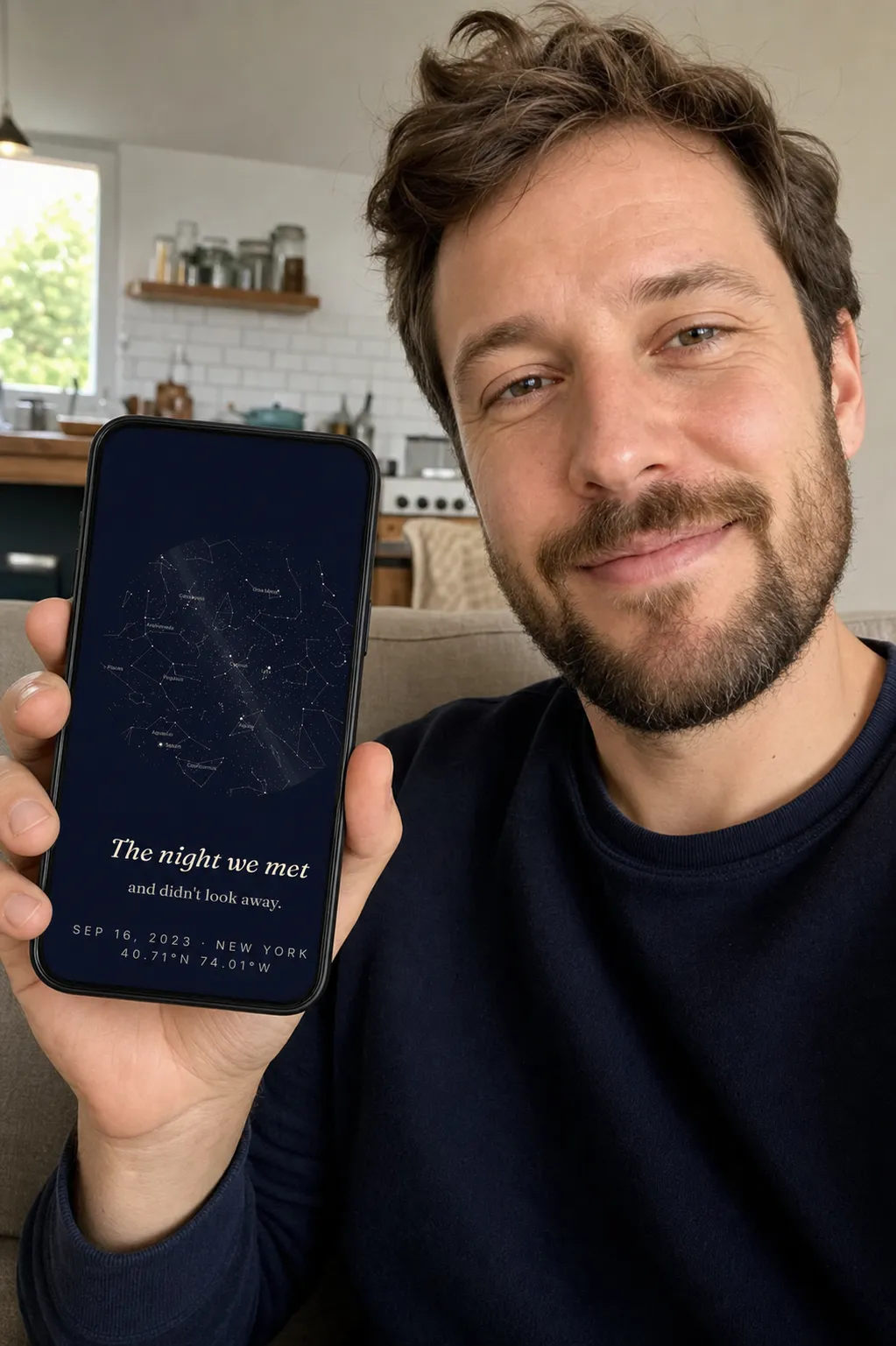 A man holding up his phone showing a SkyWhen star map wallpaper